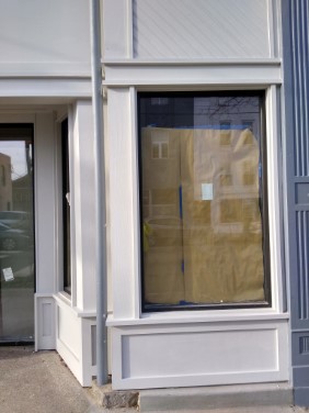 right side of store front with finished paint coat